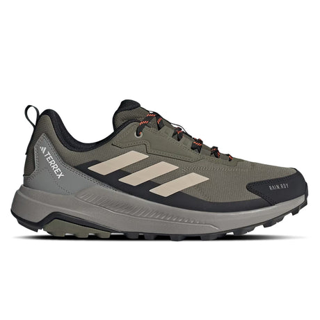 Green hiking shoe with black sole on a white background