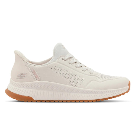 White sneaker with brown sole on a white background