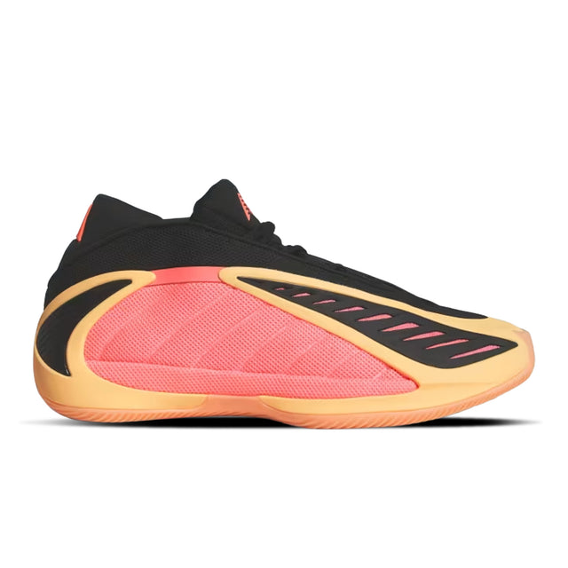 Black, pink, and yellow athletic shoe on a white background