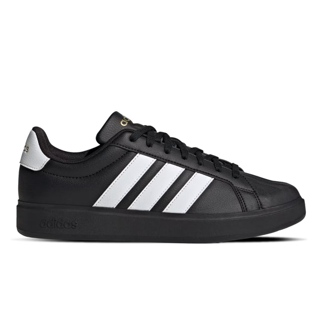 Black Adidas sneaker with white stripes on a white background