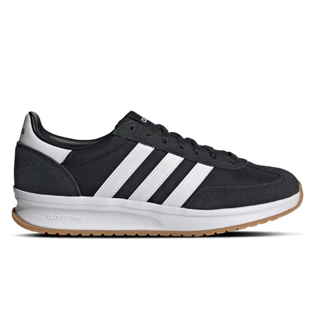 Black Adidas sneaker with white stripes on a white background