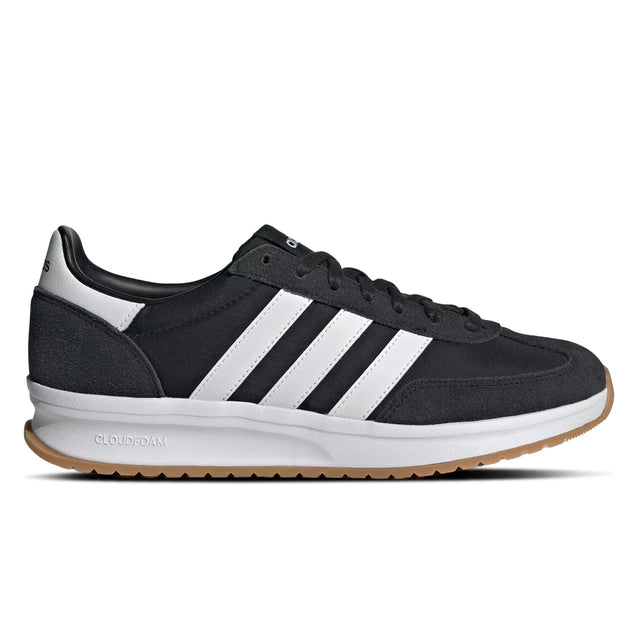 Black Adidas sneaker with white stripes on a white background