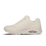 Beige sneaker with air cushion sole on a white background
