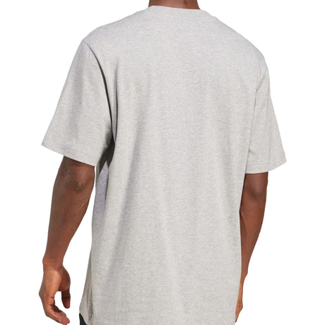 Gray t-shirt worn by a person on a white background