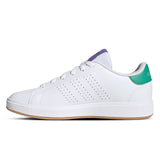 White sneaker with green heel tab on a white background
