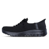 Black sneaker with visible brand logo on a white background