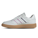 White sneaker with pink stripes and brown sole on a white background