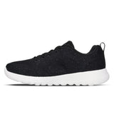 Black sneaker with white sole on a white background
