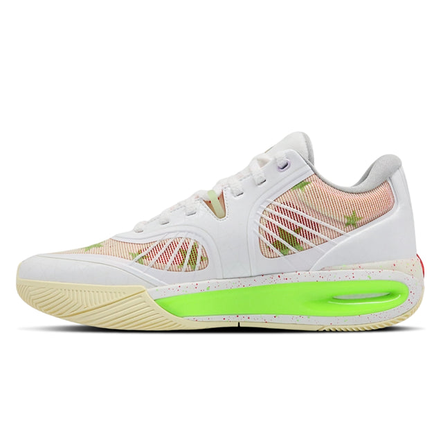 White sneaker with green sole on a white background