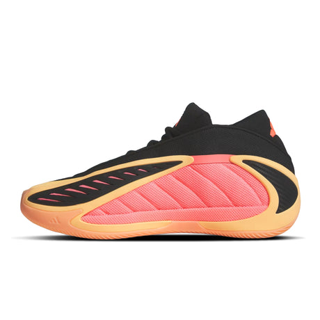Black and pink sneaker with orange sole on a white background