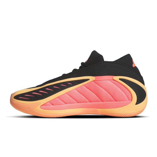 Black and pink sneaker with orange sole on a white background