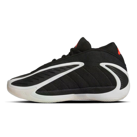 Black and white sneaker with red accents on a white background