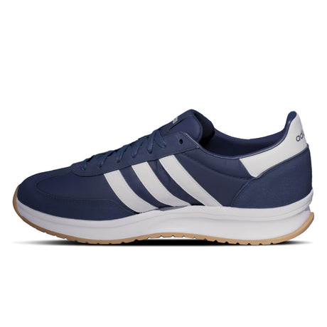 Navy blue and white Adidas sneaker on a white background