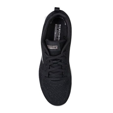 Black sneaker with visible brand logo on a white background