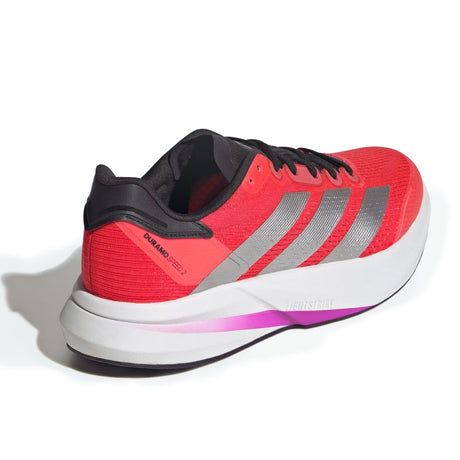 Red running shoe with black and gray accents on a white background