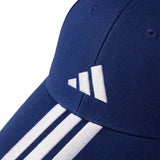 Close-up of a blue cap with white stripes and logo on a white background