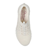 White sneaker with lace-up design on a white background