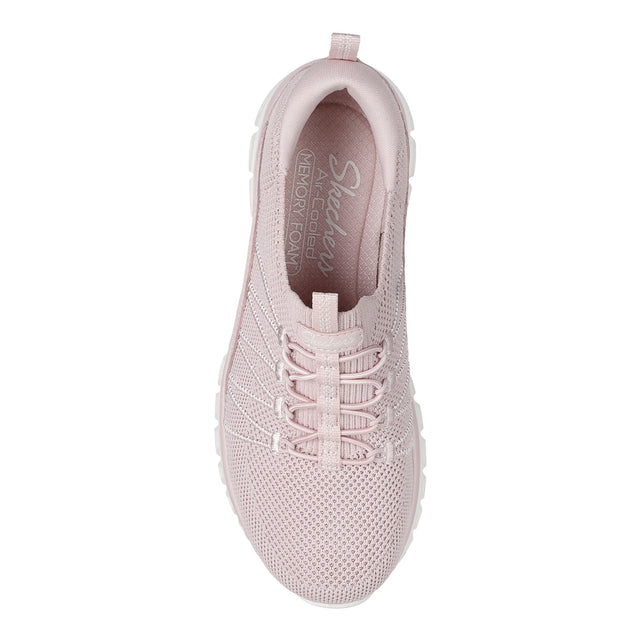 Pink sneaker with 'Skechers' branding on a white background