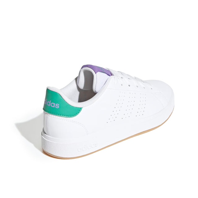 White Adidas sneaker with green accents on a white background