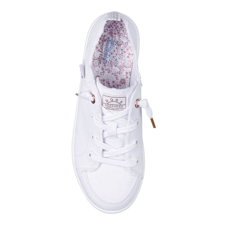 White sneaker with floral lining on a white background