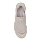 Beige slip-on shoe with 'Skechers' branding on a white background