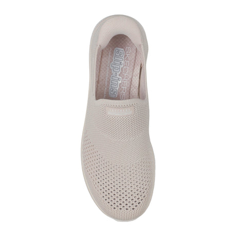 Beige slip-on shoe with 'Skechers' branding on a white background