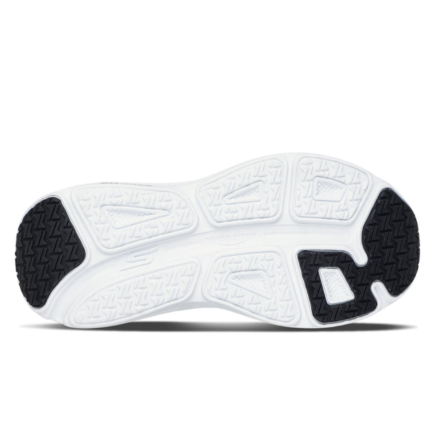 Close-up of a white sneaker sole with black accents on a white background