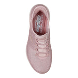 Pink sneaker with 'Skechers' branding on a white background