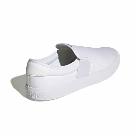 White slip-on sneaker with Adidas logo on a white background