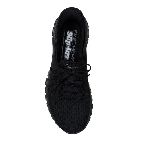 Black sneaker with 'Skechers' branding on a white background