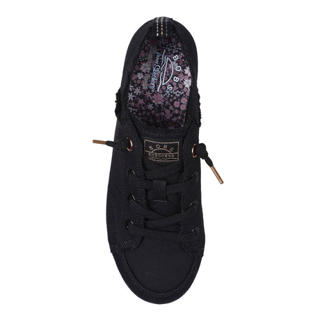 Black sneaker with floral pattern on the sole on a white background