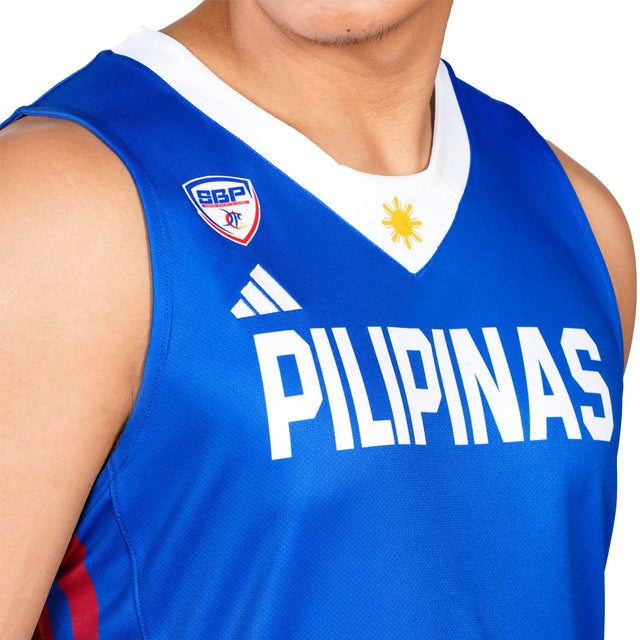 Blue sports jersey with 'PILIPINAS' text and logos on a white background