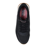 Black sneaker with visible brand logo on a white background