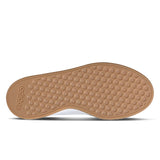 Brown shoe sole with Adidas logo on a white background