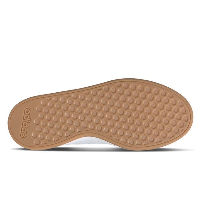 Brown shoe sole with Adidas logo on a white background