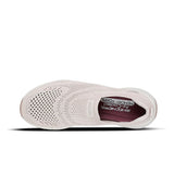 White sneaker with mesh design on a white background