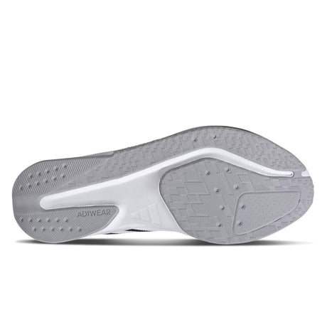 Close-up of a gray athletic shoe sole with 'Adiwear' branding on a white background