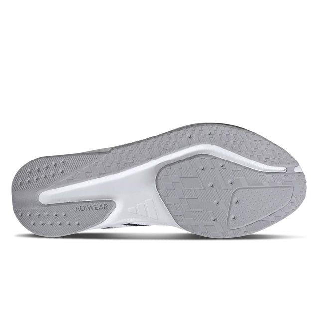 Close-up of a gray athletic shoe sole with 'Adiwear' branding on a white background