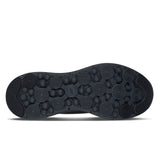Black shoe sole with circular patterns on a white background