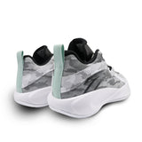 Gray and black sneakers with a green accent on a white background