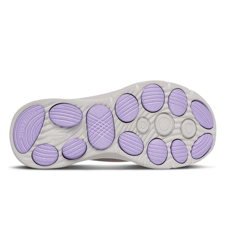 Close-up of a shoe sole with purple patterns on a white background