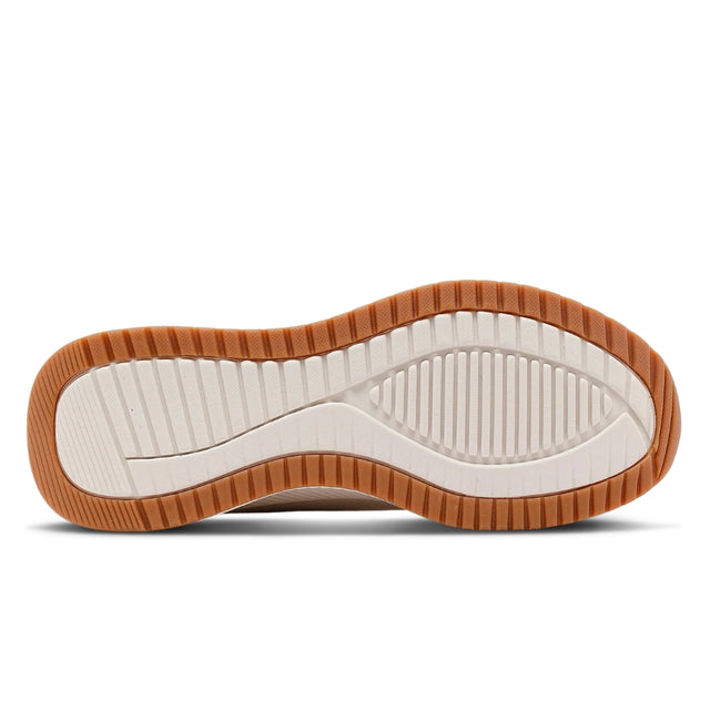 Close-up of a shoe sole with brown tread pattern on a white background