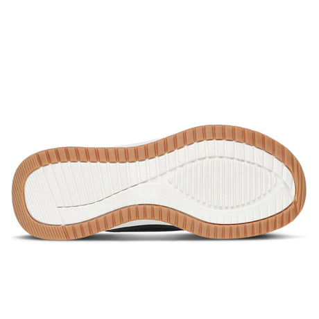 Sole of a shoe with brown border and white interior on a white background