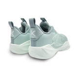 Pair of light blue sneakers with white soles on a white background