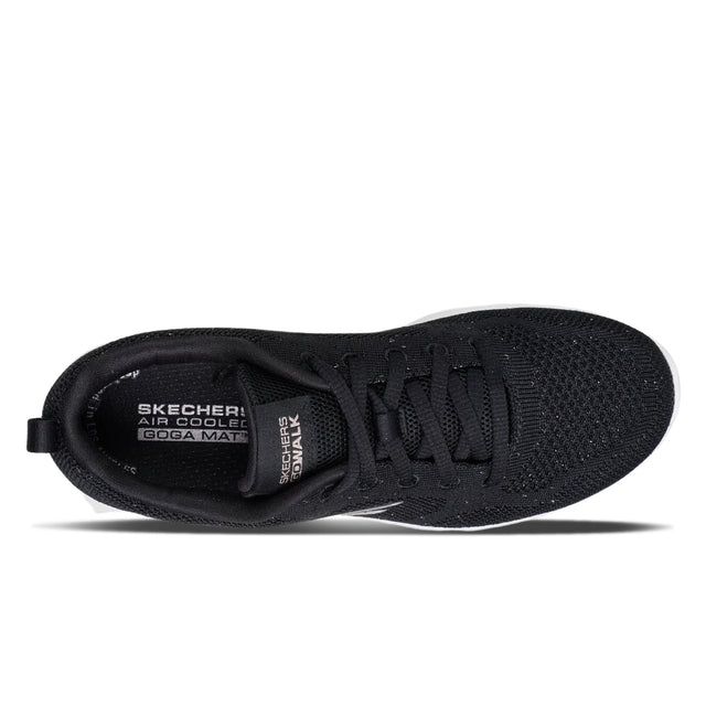 Black sneaker with Skechers branding on a white background