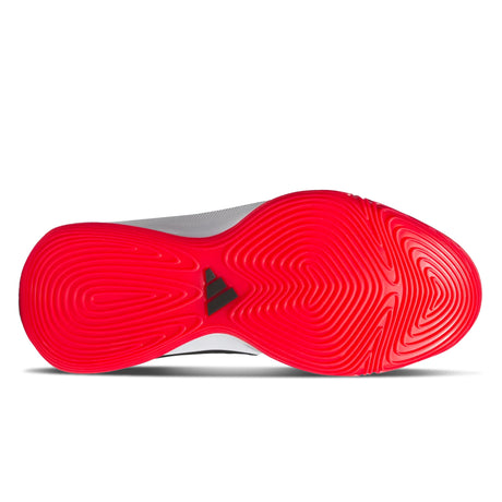 Red sole of a shoe with a brand logo on a white background