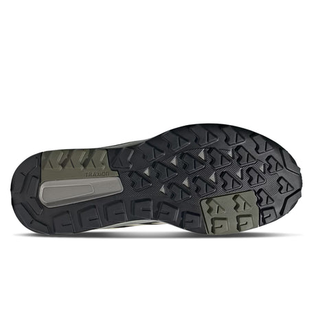 Close-up of a shoe sole with tread pattern on a white background