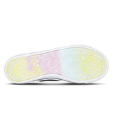 Close-up of a shoe sole with a colorful, tie-dye pattern on a white background