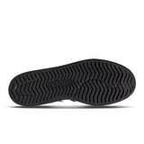 Black Adidas shoe sole on a white background