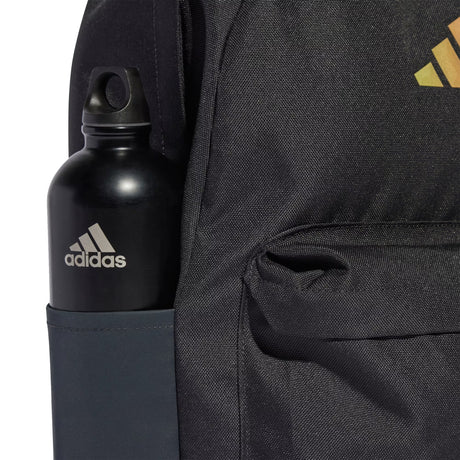 Black Adidas water bottle in a backpack pocket with Adidas logo on backpack.